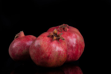 pomegranates on a black background