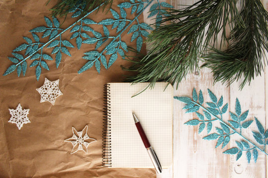 Christmas decorations. Note. Notepad on the table. Preparation for the winter holidays. New year mood. Happiness.  To do list. Space for text.