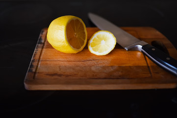 lemon cut on the cutting table with a knife