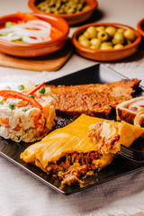 Christmas dish in Venezuela, hallaca, ham bread, salad and pork