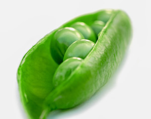 Pod with fresh green peas.