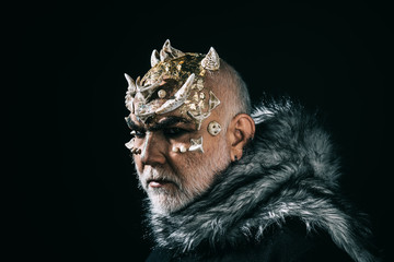 Mythical king of permafrost realm in fur collar isolated on black background. Magical beast with...