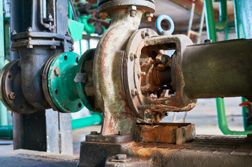 Old rusted cold water pump close up.