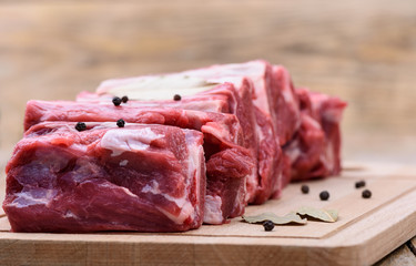 Selective focus. Raw brisket meat on a cutting board