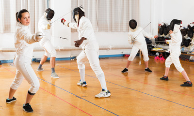 Woman training fencing movements