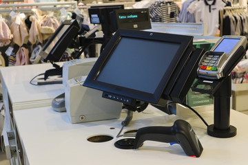 The work of the cashier. The cash register in the store