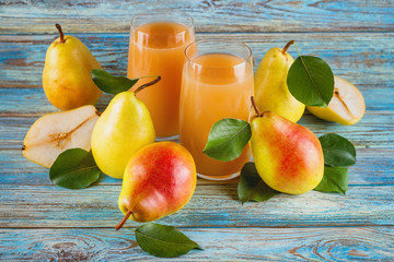 fresh organic farm pear juice in glass with raw whole and sliced