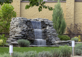 fountain with two overflows, in antique style. Using natural materials such as wild marble, slate,...