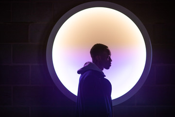 Profile of a man with hoodie on a light background