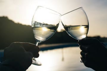Couple hands drinking toasting with wine