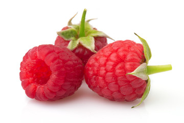 Ripe red raspberries isolated on white