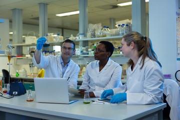 Team of scientists experimenting together