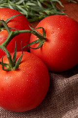 Fresh tomatoes on a table. Tomatoes background. Harvest vegetable cooking conception