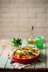 casserole with vegetables and salami .style rustic