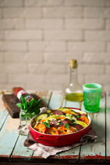 casserole with vegetables and salami .style rustic