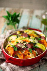 casserole with vegetables and salami .style rustic