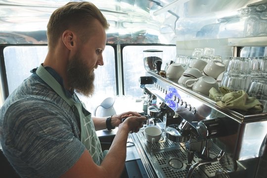 Waiter Preparing Coffee In Food Truck
