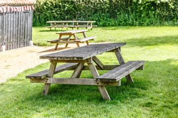 Recreation and rest area with several old wooden benches