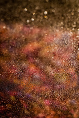 Warm toned particle abstract background.