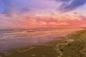 sunset at beach on a bad weather day