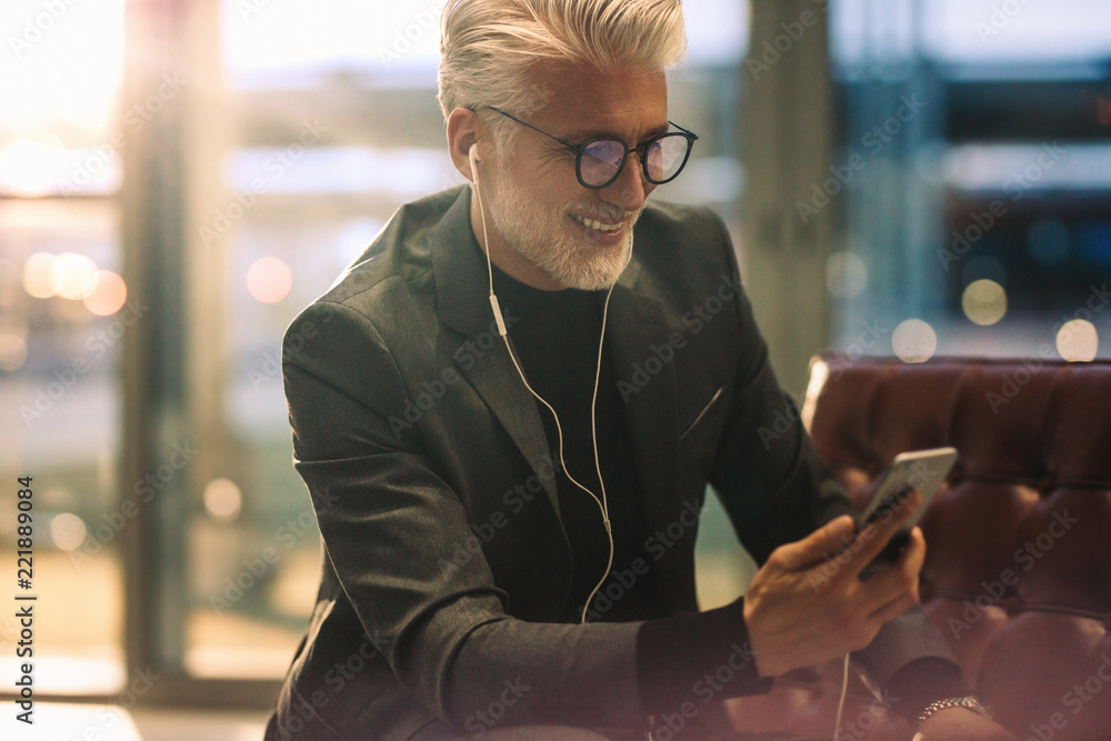 Wall mural businessman making video call in office lobby