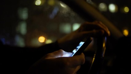 Using smartphone while driving at night in the city