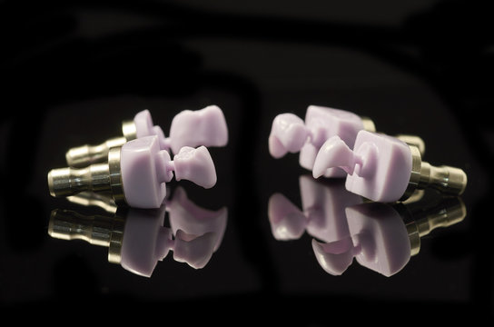 Four molars of lithium Disilicate glass-ceramic block for the CAD CAM technology.