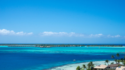 Fototapeta na wymiar Fitiiu Point, Bora Bora's Blue Lagoon And Clear Blue Sky