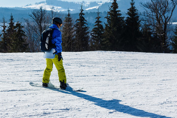 man snowboarding