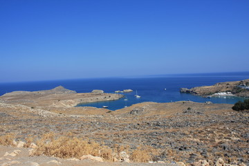 View of village, bay and Acropolis of Lindos (Rhodes, Greece)
