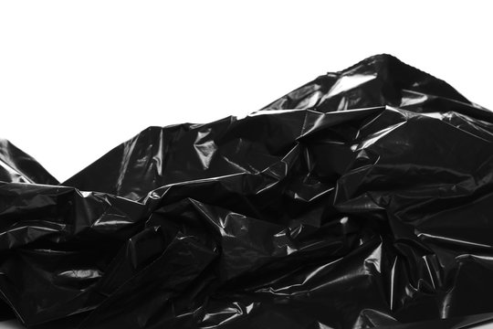 Crumpled, black plastic bag, isolated on white background, design elements, side view