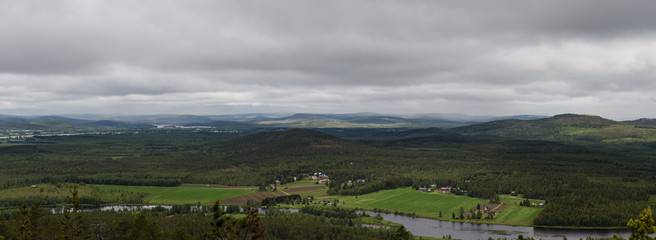 Views from the top of Aavasaksa mountain with houses, forest and mountains