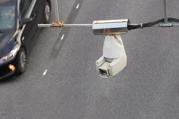 CCTV camera or surveillance operating on traffic road.