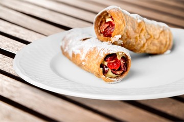 Delicious pancakes with berries on white plate