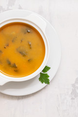 pumpkin soup in white bowl