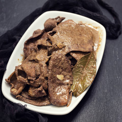 fried liver on white dish