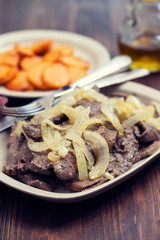fried liver on white dish and fried sweet potato on plate