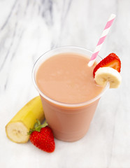 Strawberry and Banana Smoothie in a Disposable Plastic Cup
