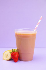 Strawberry and Banana Smoothie in a Disposable Plastic Cup