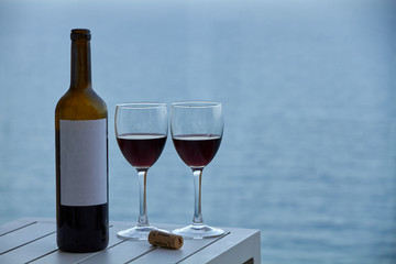 wine bottle with two glasses