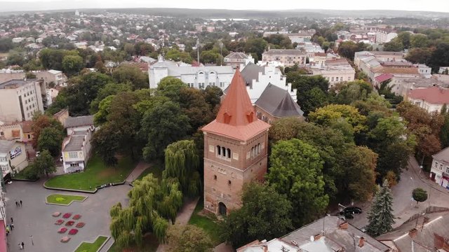 Aerial view of bell tower and ancient church St. Bartholomew, fly around technique. Drohobych city, center of salt making in Ukraine