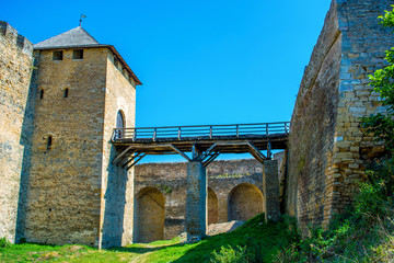 Photo of ancient stone castle with many hight towers in Khotym