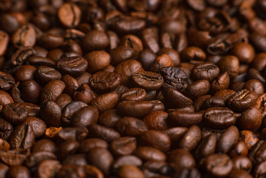 The texture of roasted coffee beans. Macro image