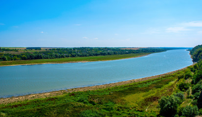 Fototapeta na wymiar Photo of big river in Khotyn, view from beach