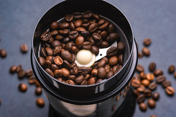 Coffee beans in a coffee grinder. The view from the top