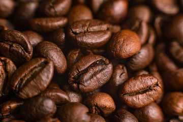 The texture of roasted coffee beans. Macro image
