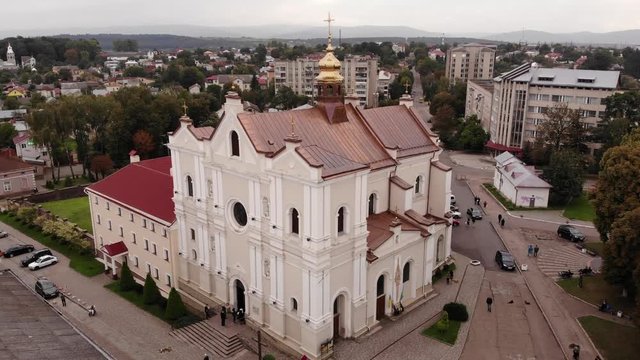Aerial view of Cathedral of the Holy Trinity in Drohobych city, Ukraine. Architecture and cityscape. Smooth flight up technique