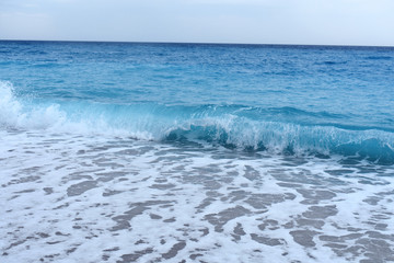 Naklejka na ściany i meble Blue sea, waves and sand. 