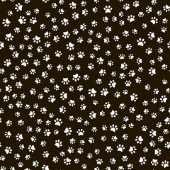 Seamless pattern with white animal footsteps on black background. Vector.