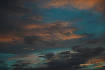 Naklejka na ściany i meble evening sunset sky with clouds illuminated by the sun